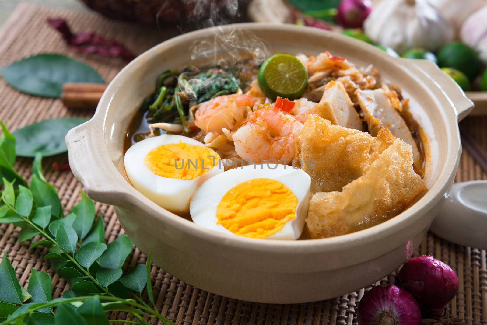 Prawn mee, prawn noodles. Famous Malaysian food har mee spicy fresh cooked in clay pot with hot steam.