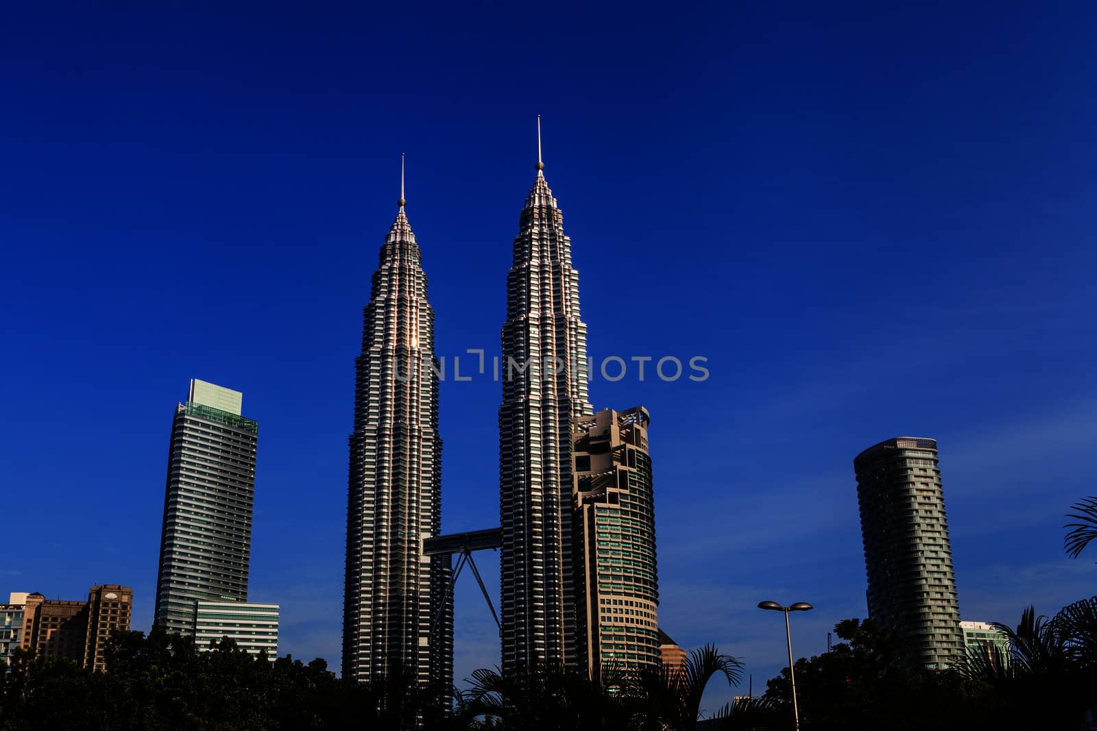 KUALA LUMPUR - JUN 6: View of The Petronas Twin Towers on Jun 6, 2012 in Kuala Lumpur, Malaysia. This famous landmark of Malaysia are the tallest twin buildings in the world (451.9 m).
