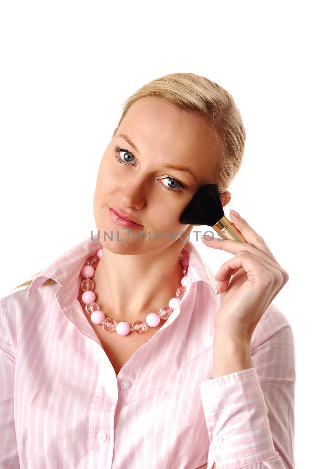 Blonde with makeup powder brush in pink clothes