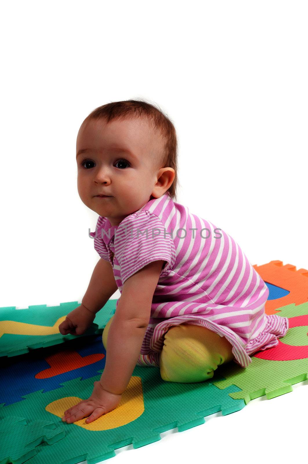 Shot of little cute baby playing with letters