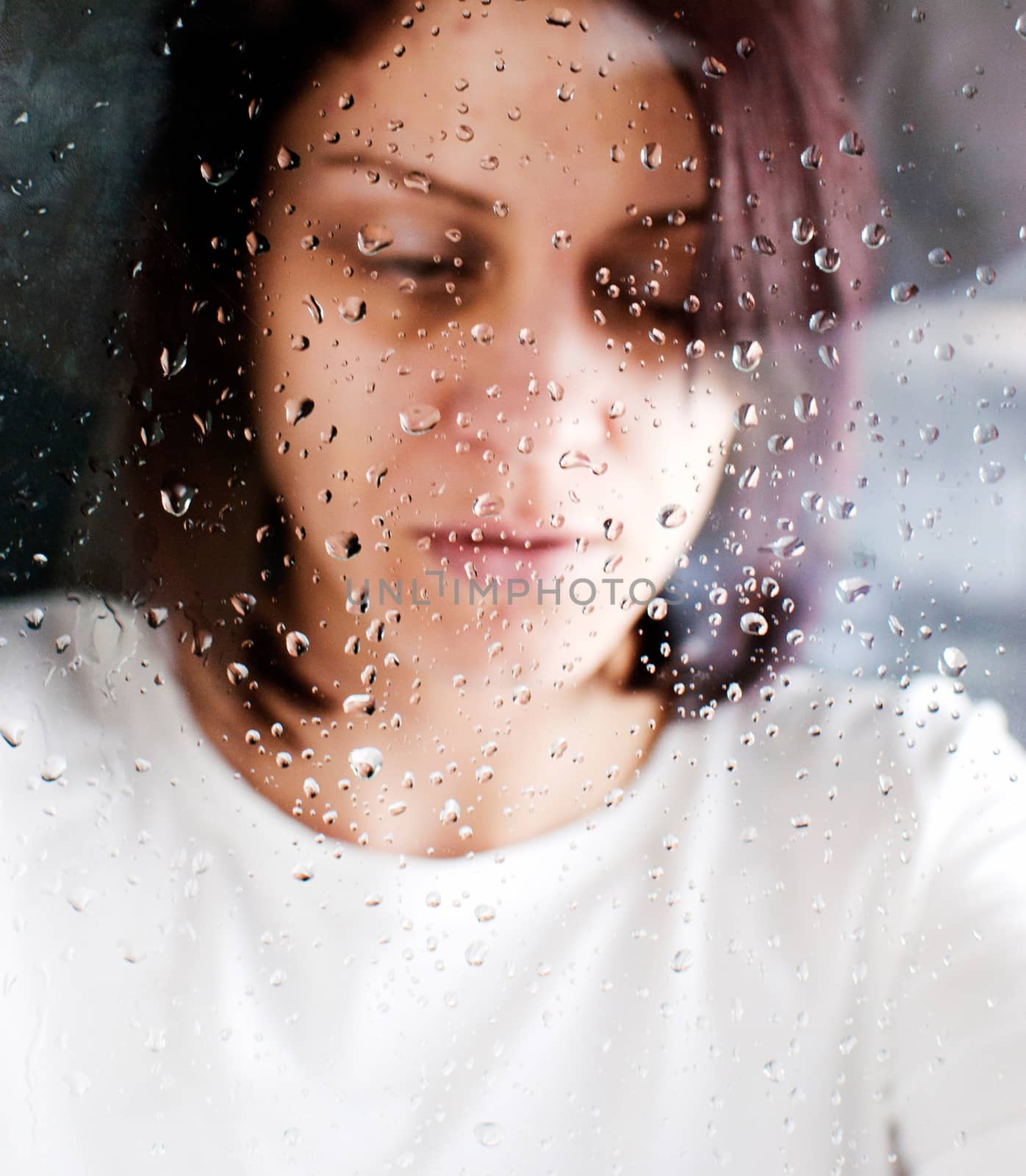 conceptual portrait of stressed abused young woman 