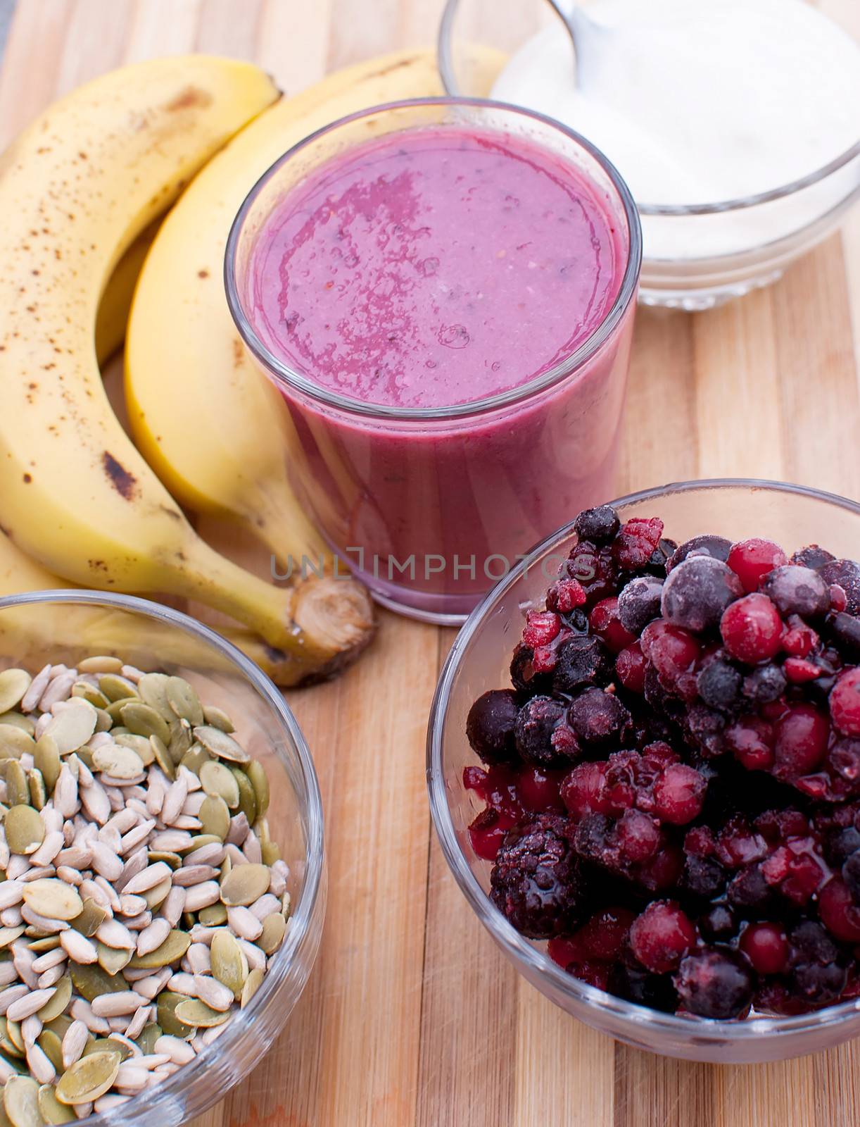 healthy berries juice smootie on wooden board