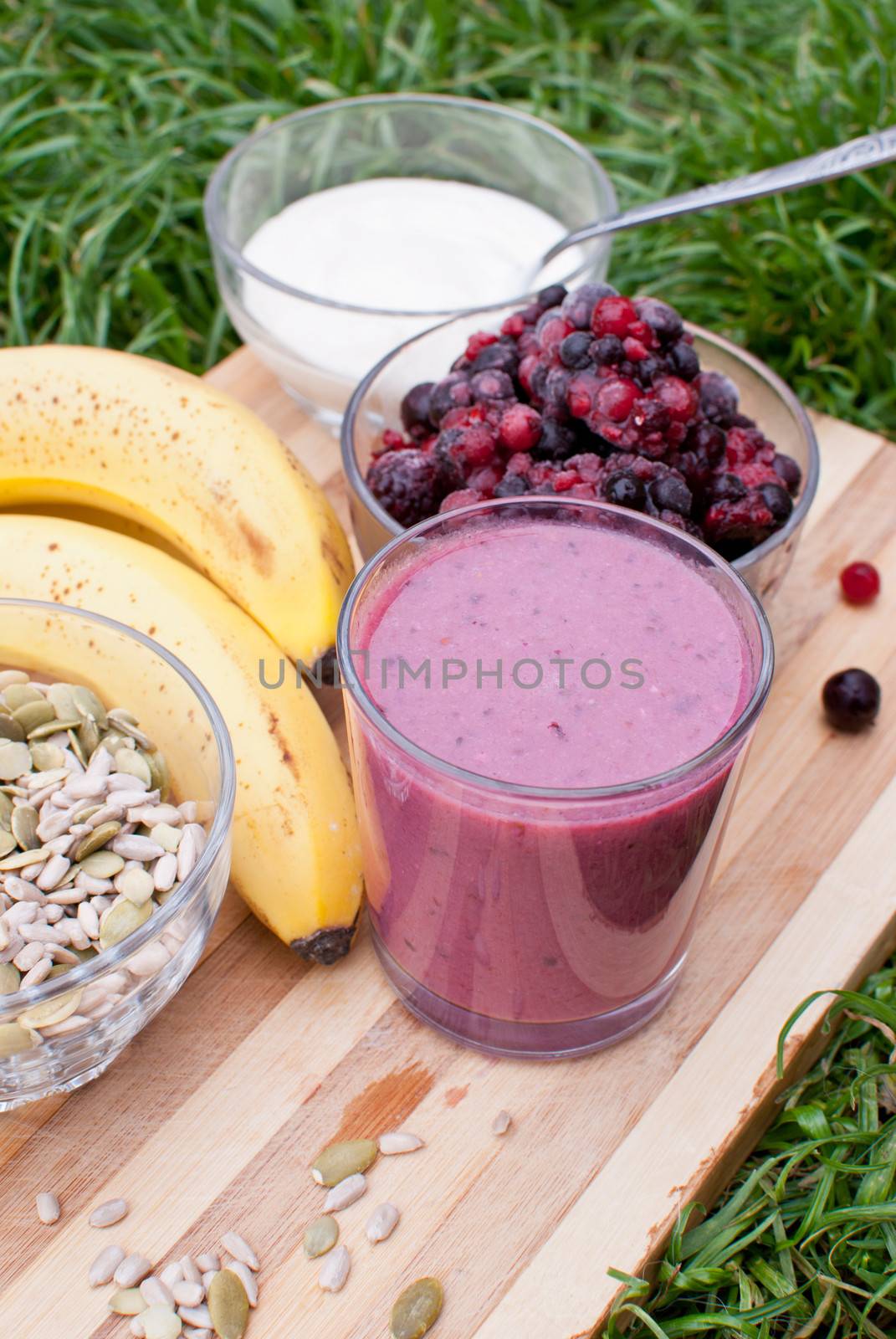 healthy berries juice smootie on wooden board