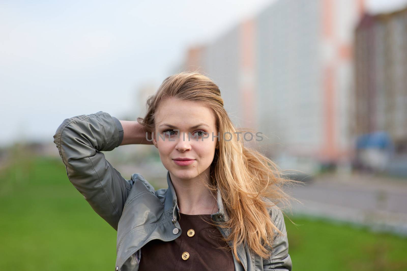 The young pleasant smiling girl with long hair by fotooxotnik