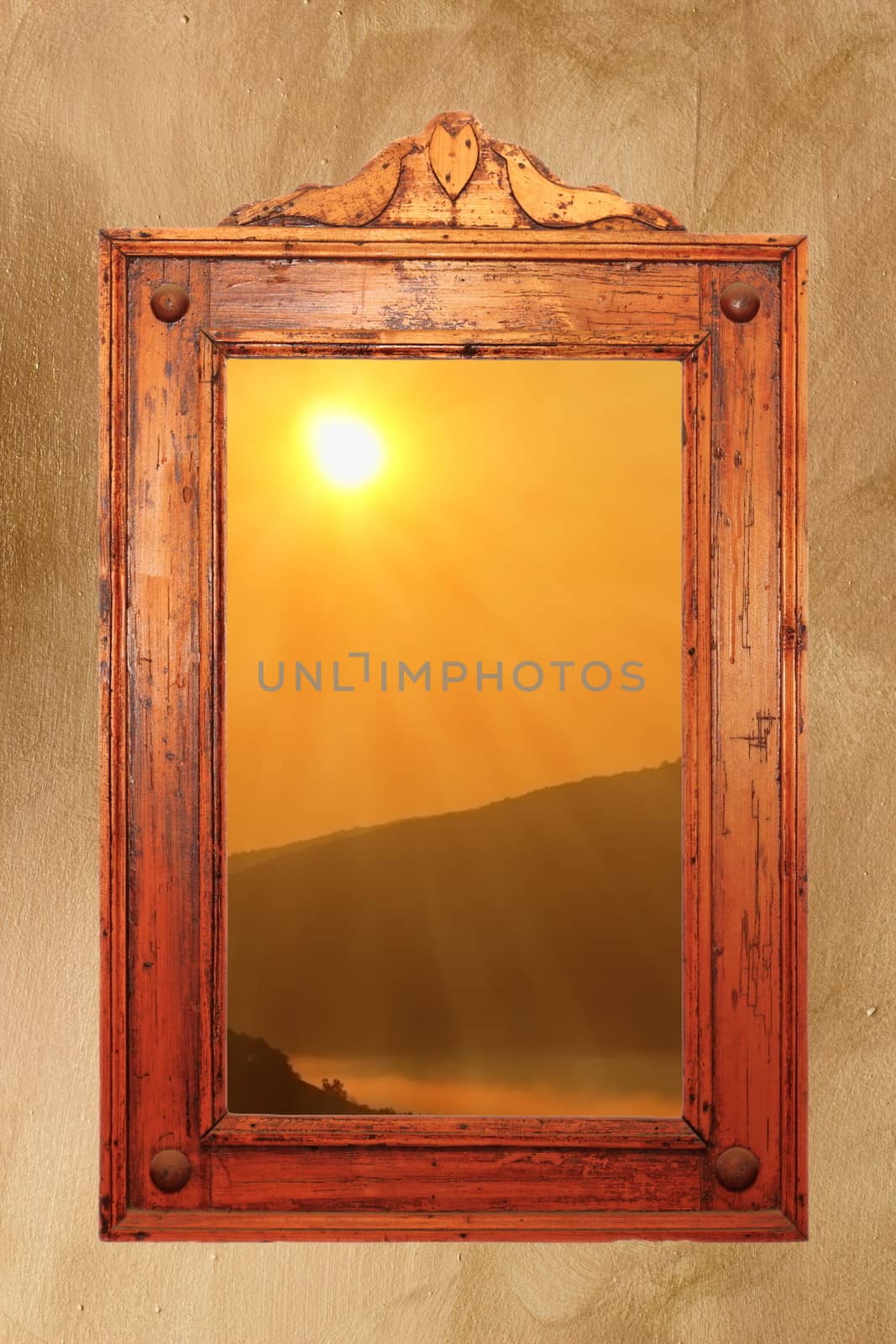 beautiful colors of sunrise seen through a window with old wooden frame