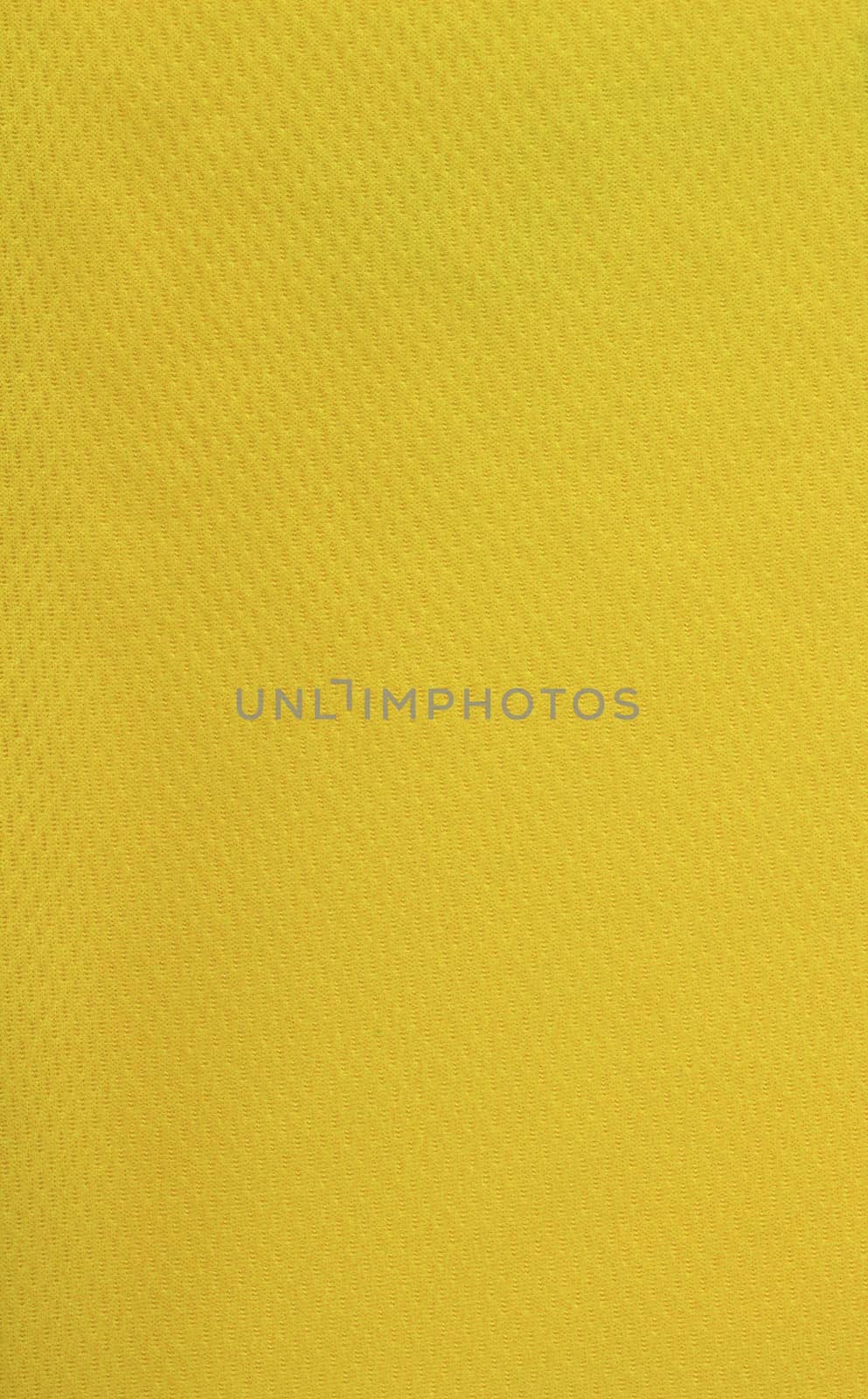 closeup of yellwo plastic fabric - sport shirt material