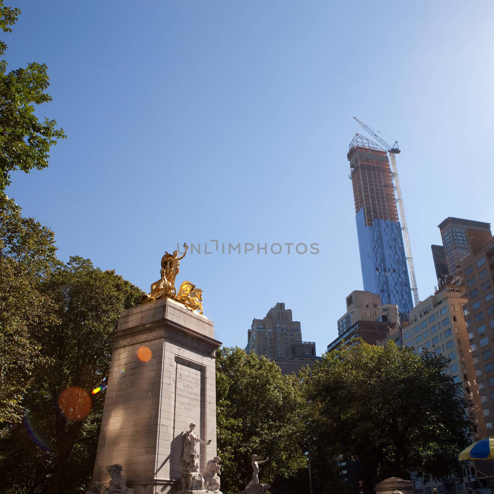 The historic golden Maine monument statue located in Colombus Circle at the south entrance of Central Park in New York City Manhattan. 