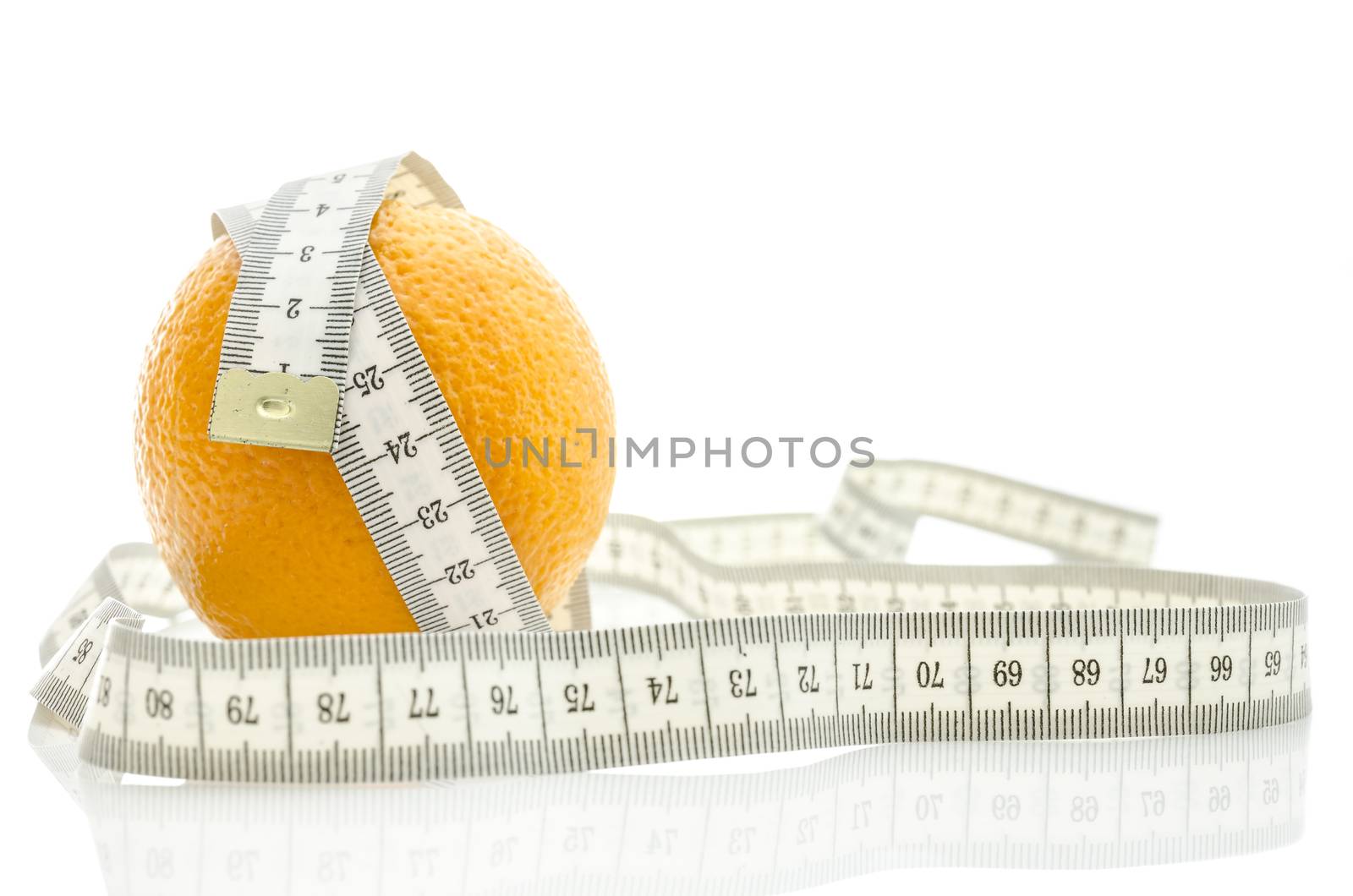 Fresh orange wrapped with measuring tape. Isolated over white background. Dieting concept.