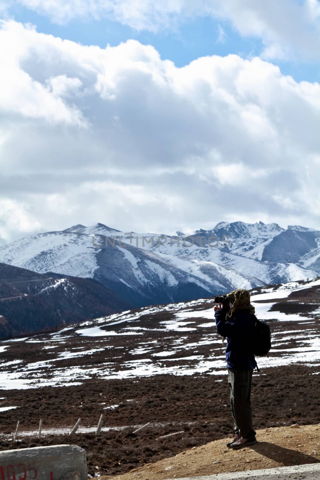 Photographer on snow mountain by liewluck