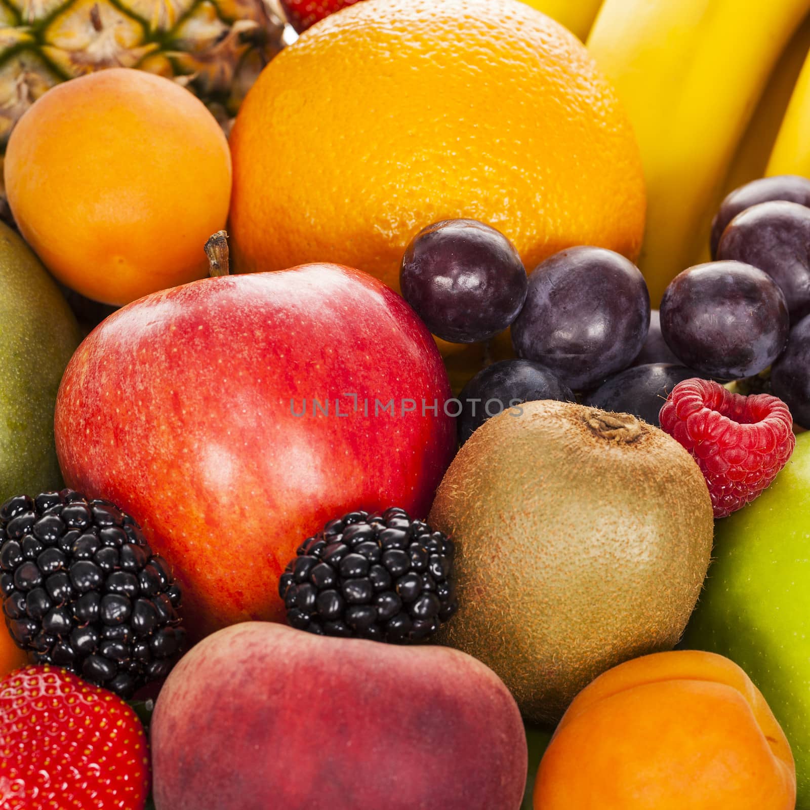 Crop of exotic fruits in studio