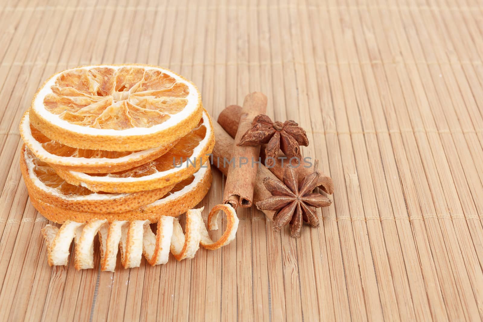 detail of Star Anise, cinnamon and dried orange  on wooden background 