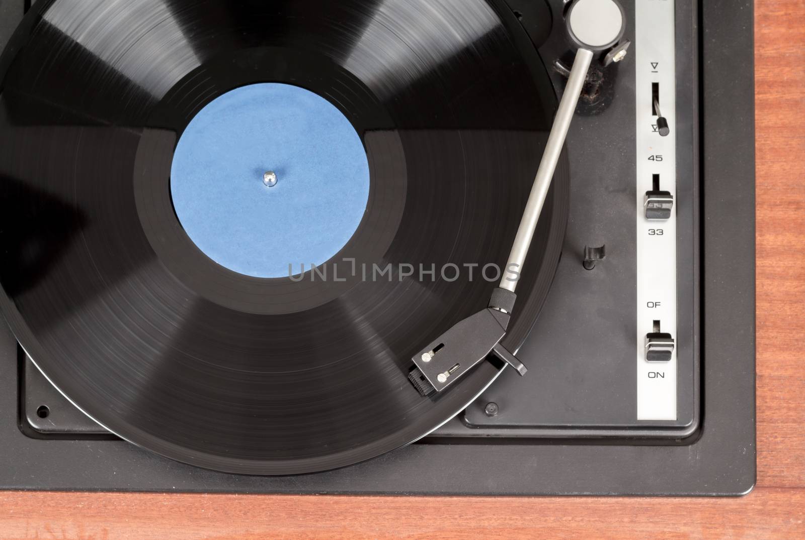Spinning vinyl record. Motion blur image.  Vintage toned. Shallow depth of field.