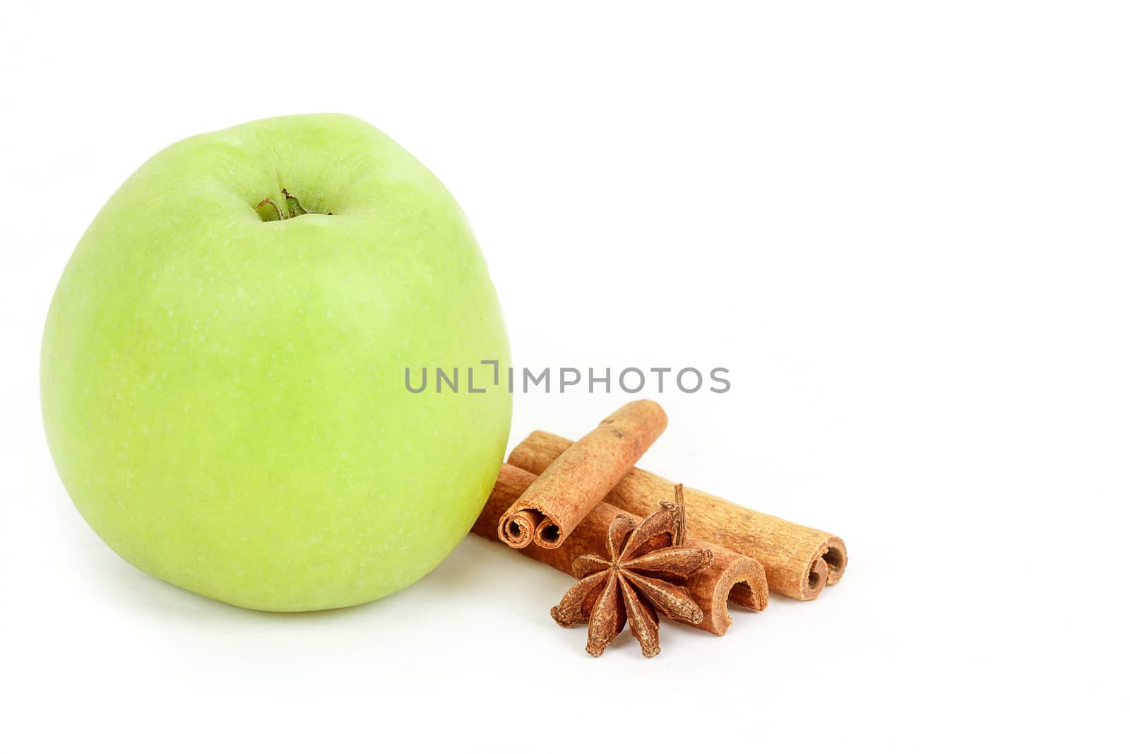 fresh green apple and spices isolated on a white background 