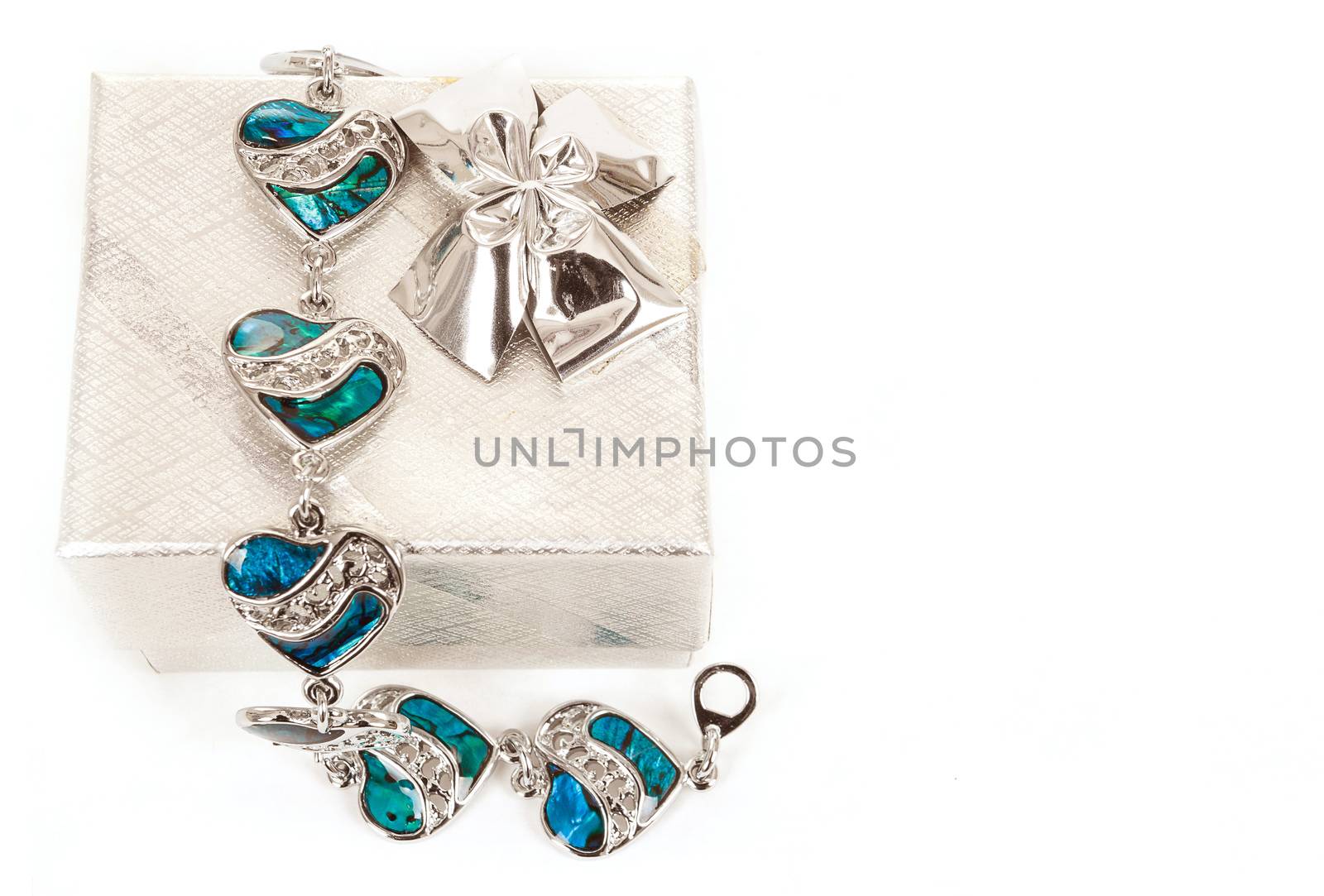 female bracelet with hearts and box isolated on white 