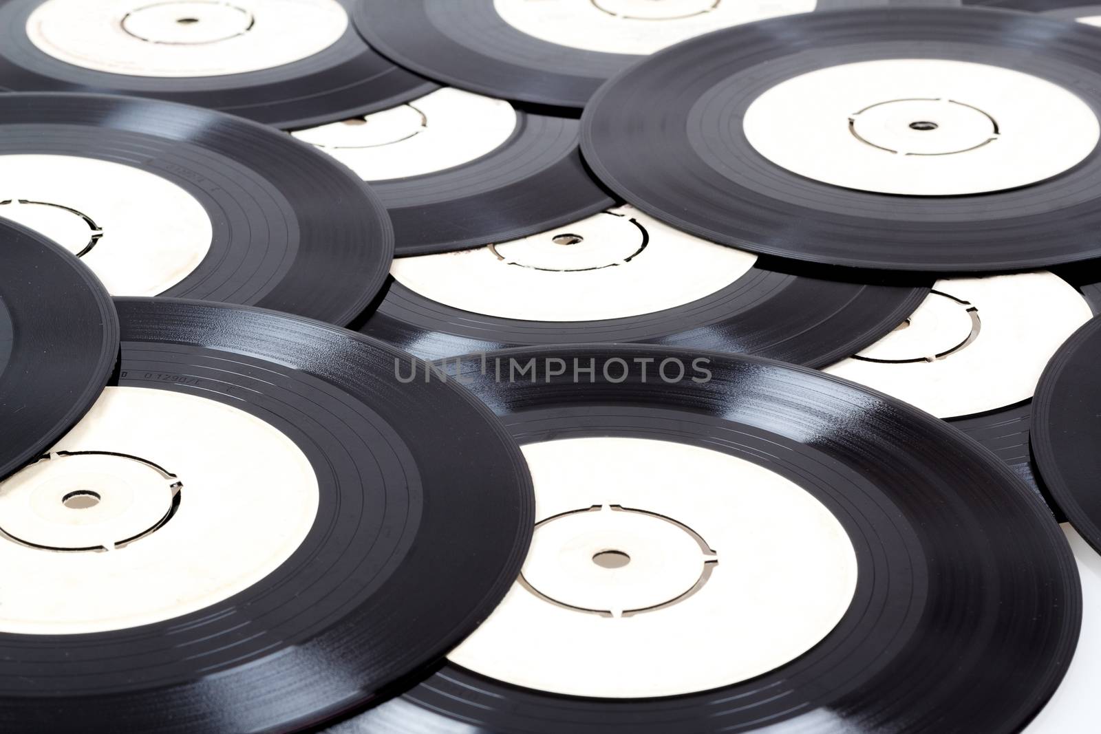 group of old small black vinyl records 