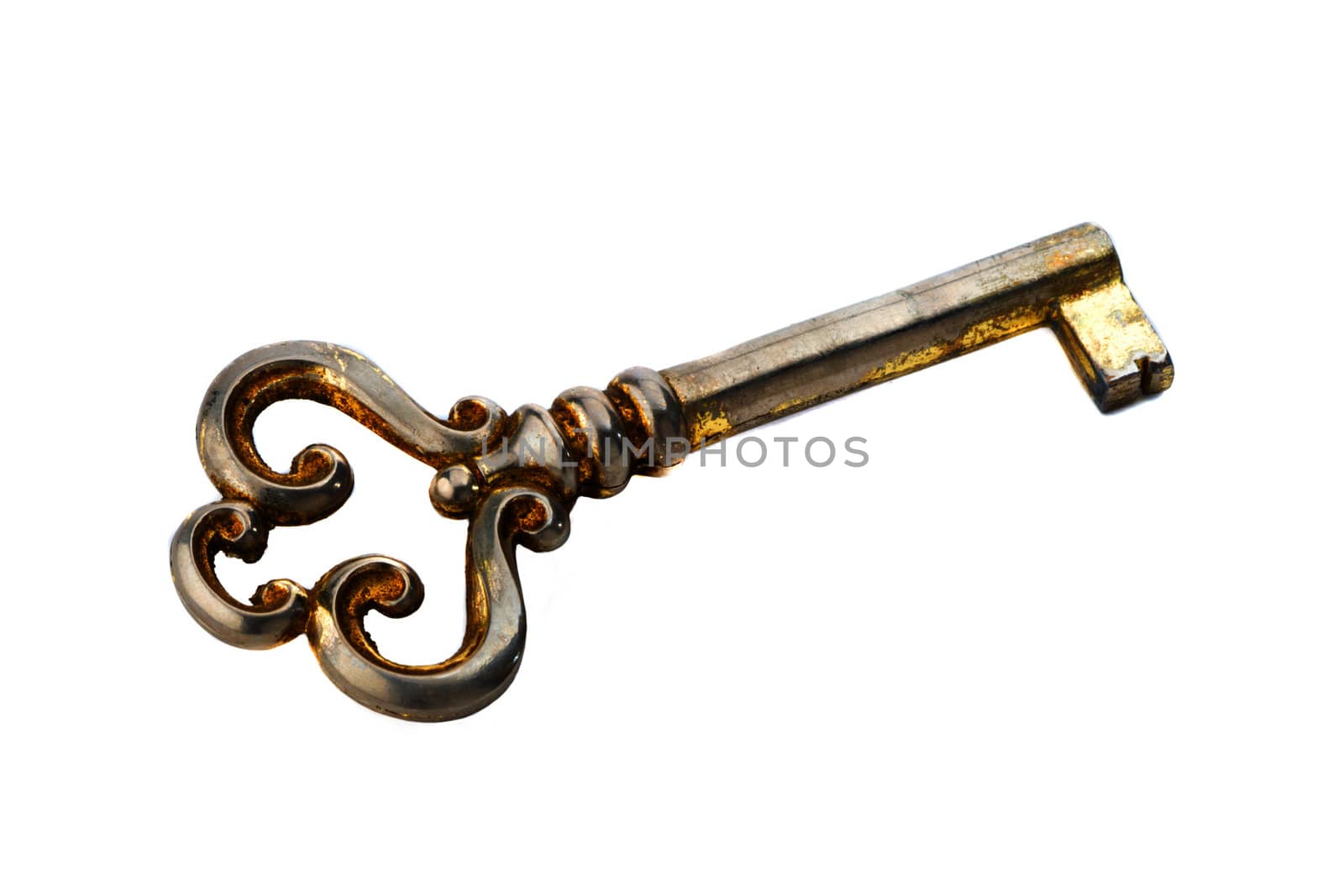 Antique yellow key on a white background in high resolution