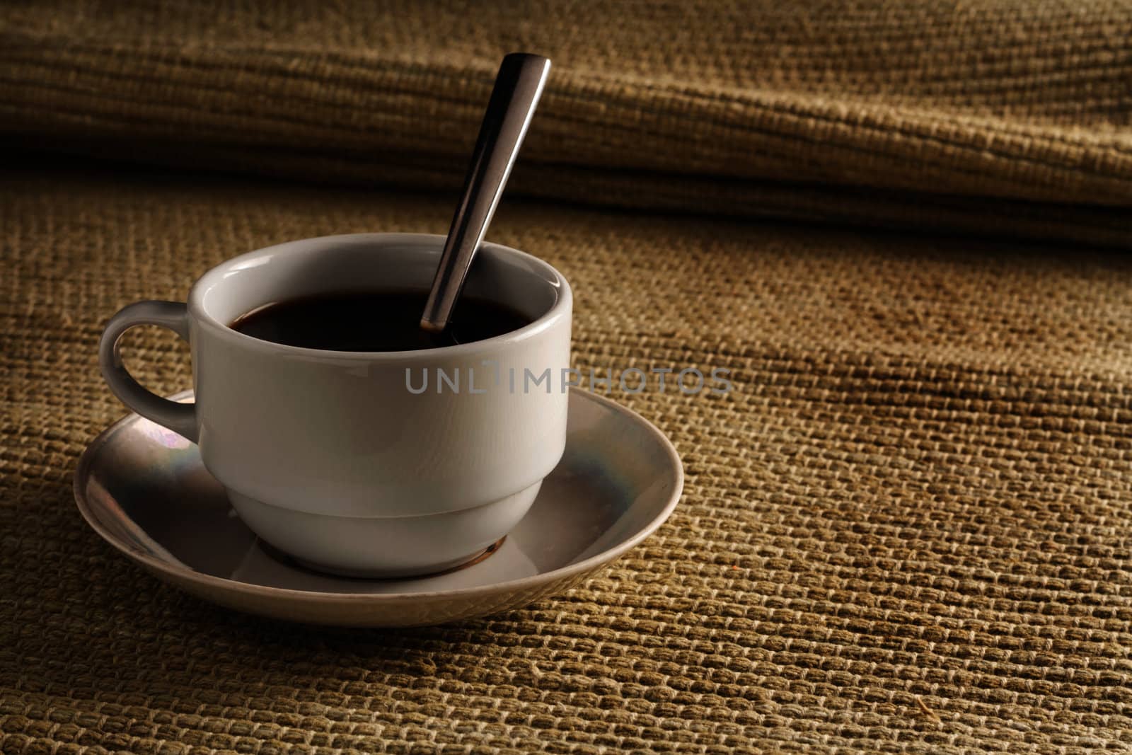 A cup of black coffee on a yellow background by dedron