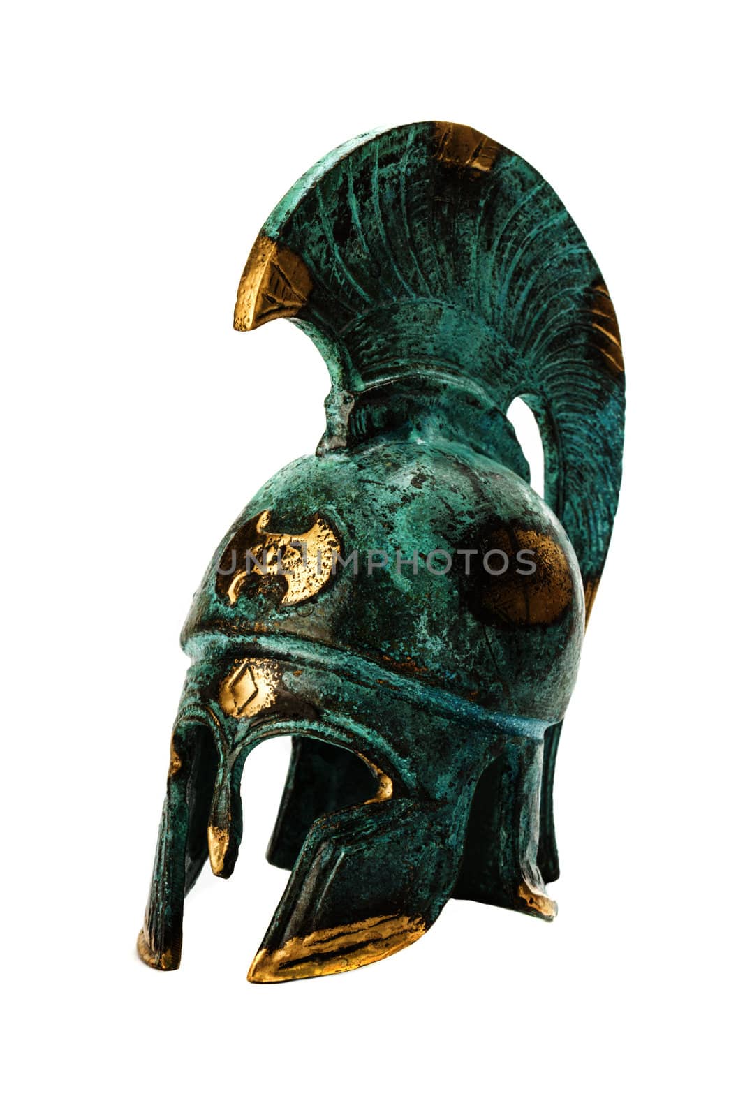 Souvenir ancient brass greek helmet over white by dedron