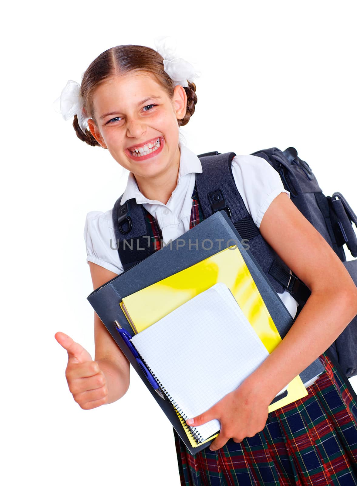 Education theme. Joyful schoolgirl smiling happily with backpack holding book. Isolated on white background