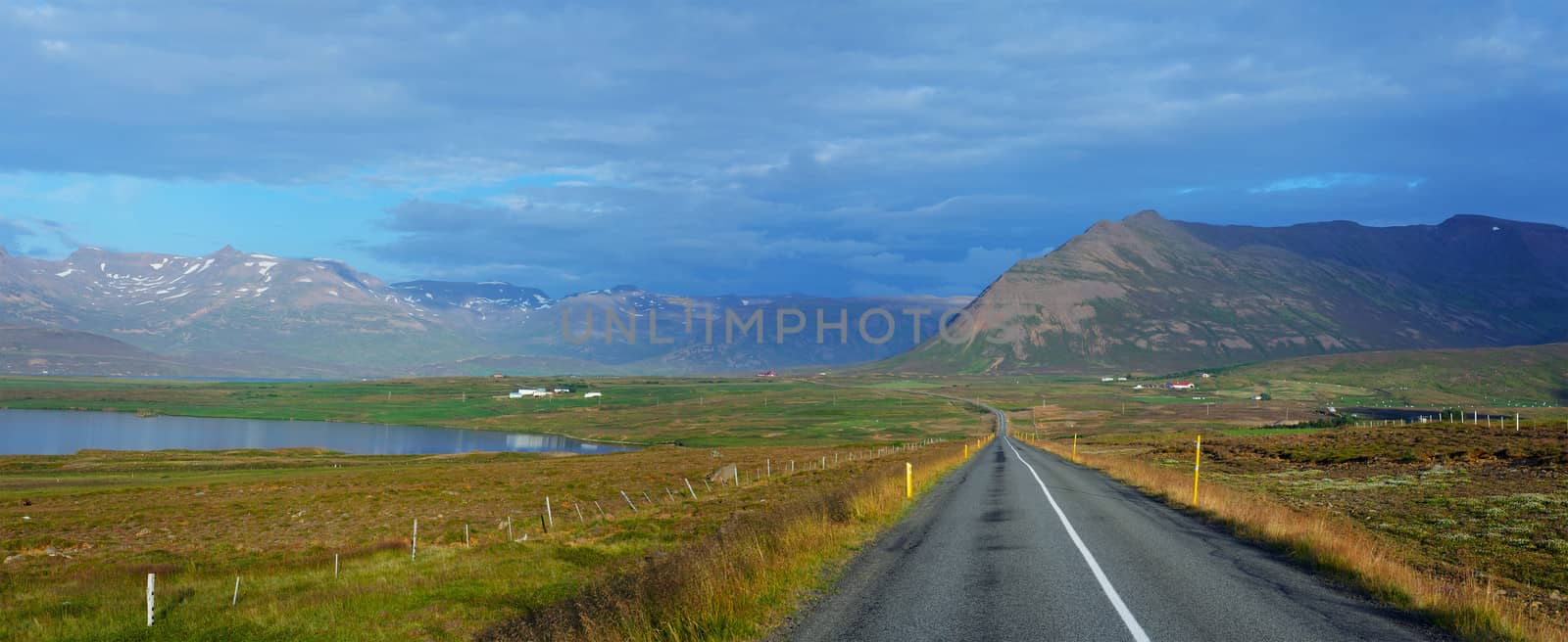 Highway through Iceland landscape at foggy day. Panorama