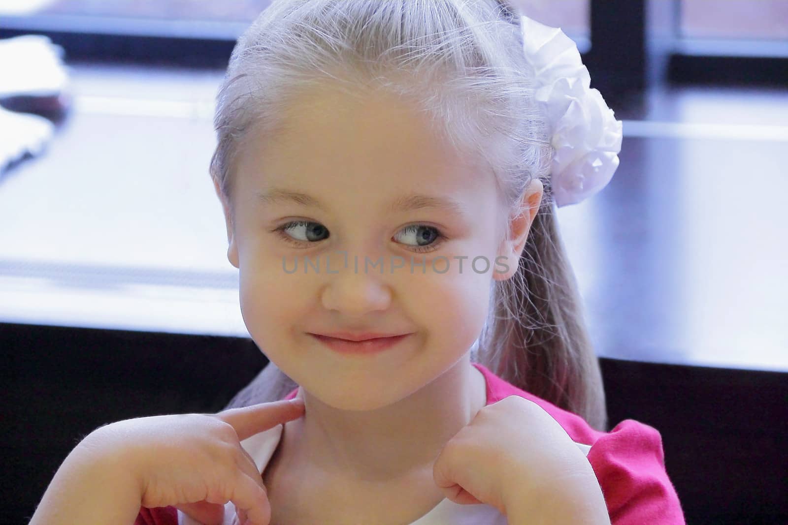 Portrait of beautiful girl with blue eyes