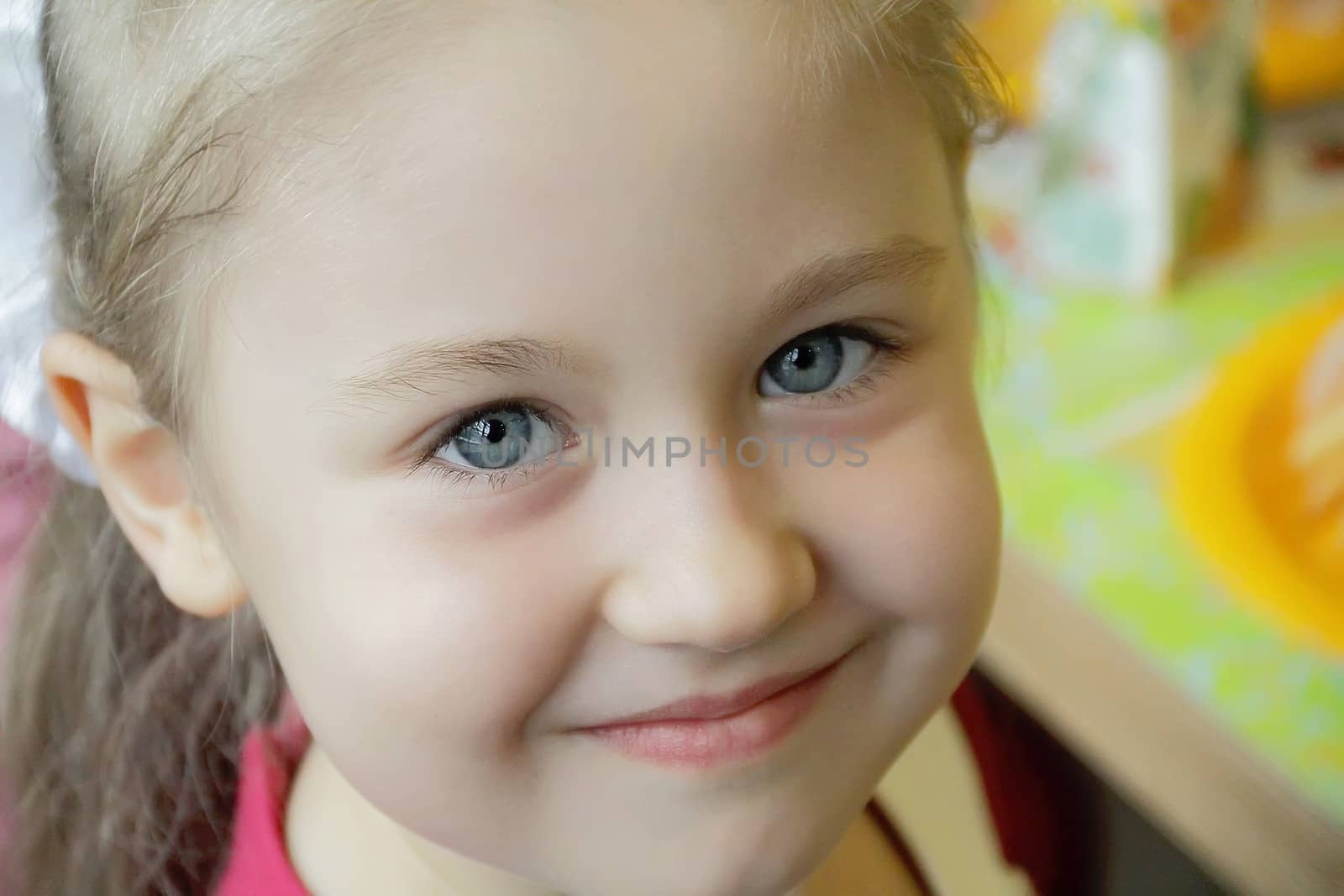 Portrait of beautiful girl with blue eyes