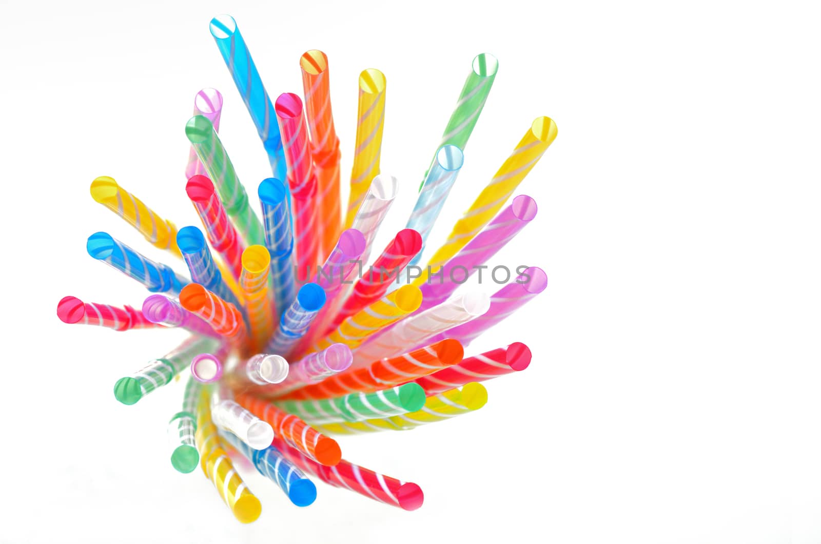 multi color flexible straws on white background