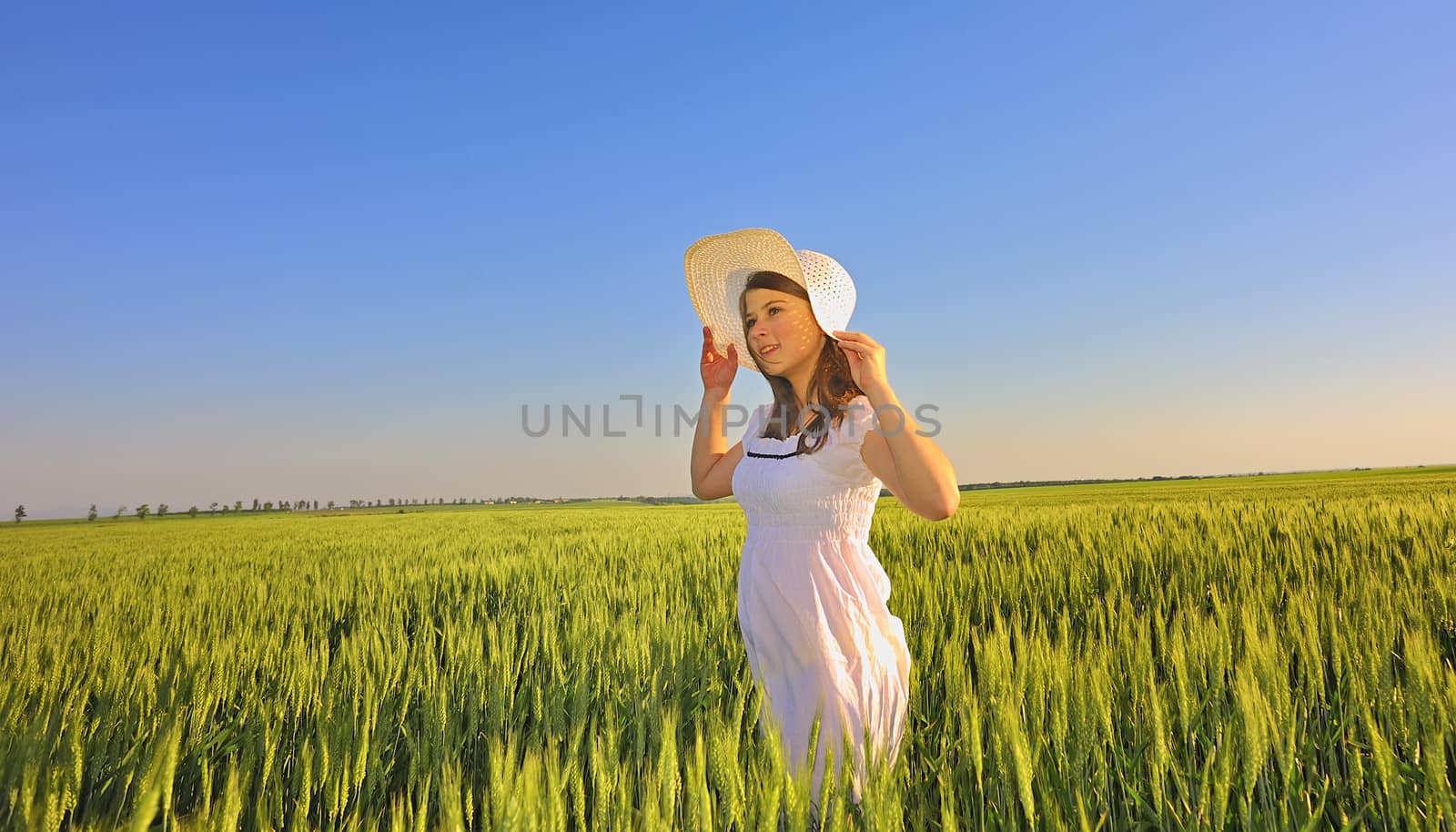 beautiful girl with hat in the field by mady70