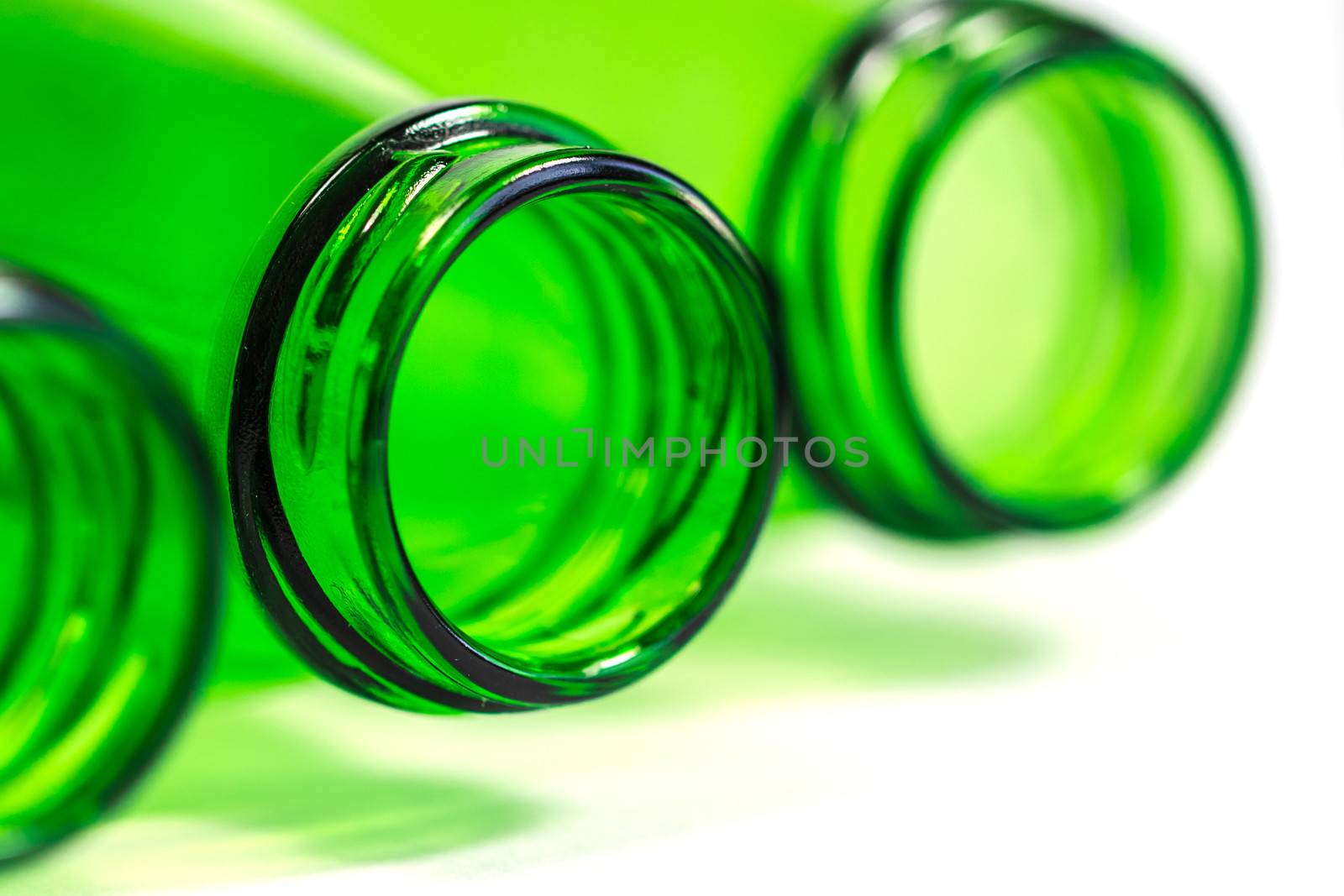 Extra Closeup of Green Bottles Lay Down on White Background with by punpleng