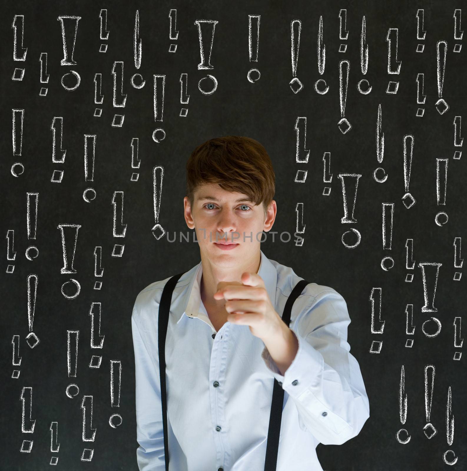 Thinking business man with chalk exclamation marks on blackboard background