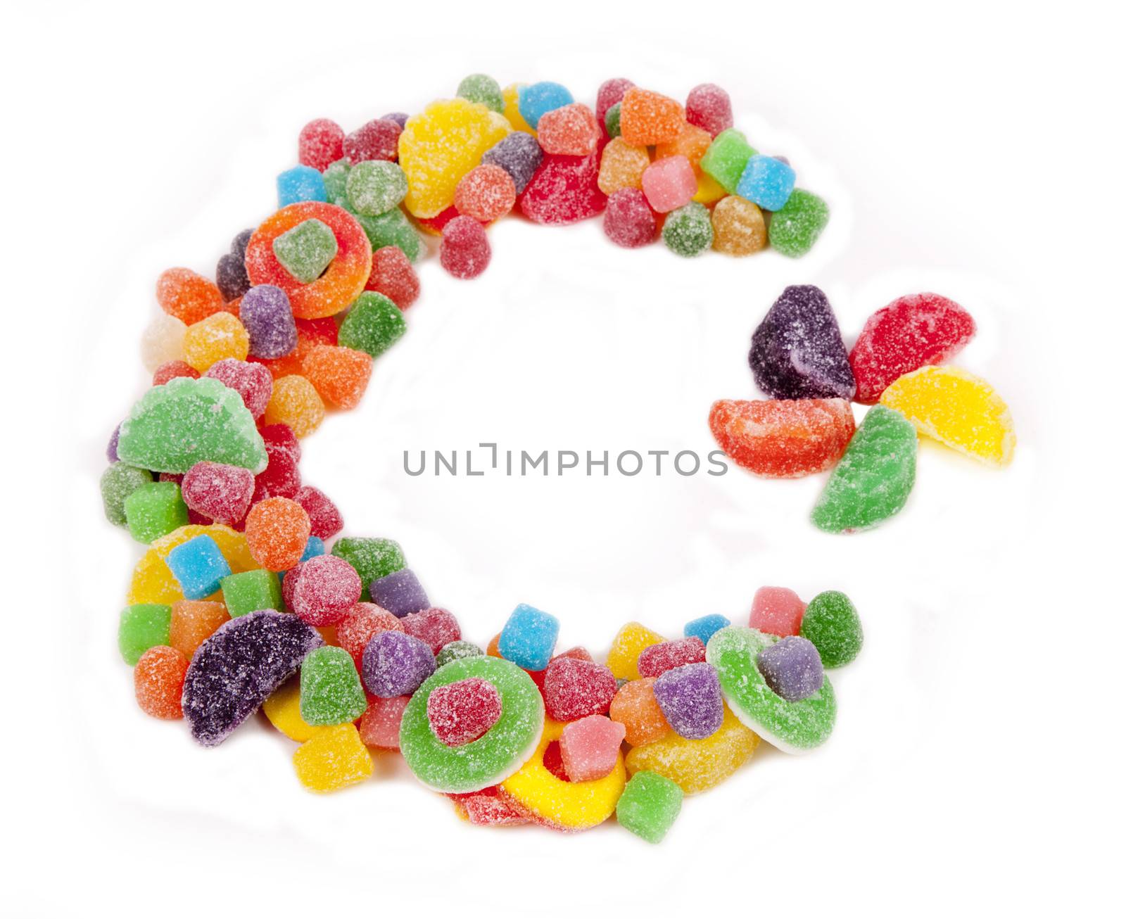 A color star and crescent moon made of candy against a white background.