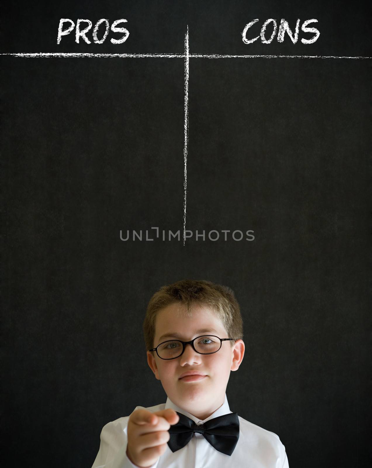 Education needs you thinking boy dressed up as business man with chalk pros and cons decision list on blackboard background