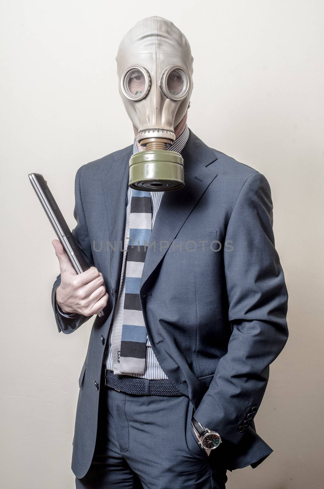 businessman with gas mask with notebook on gray background