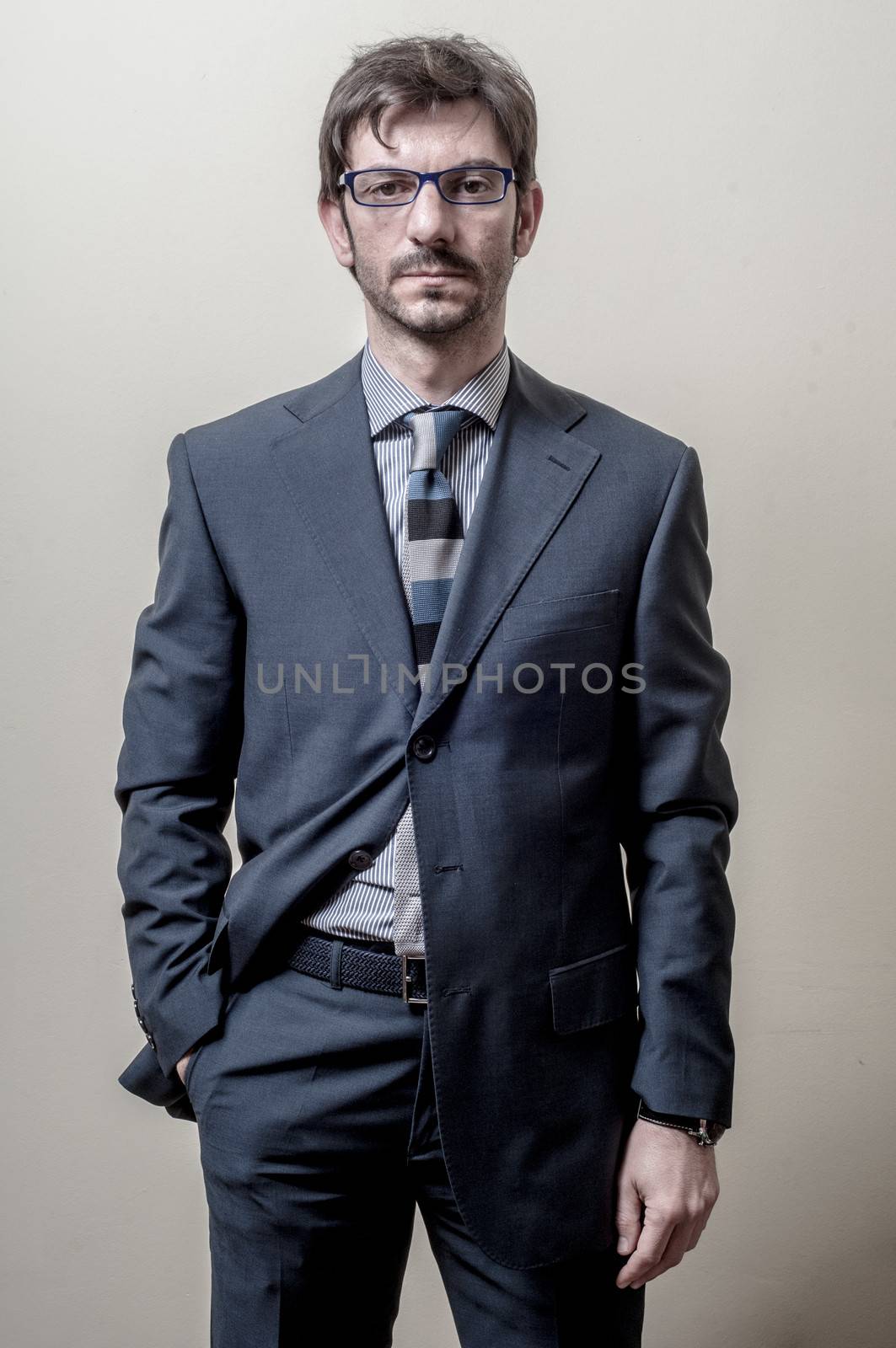 businessman with eyeglasses isolated on gray background
