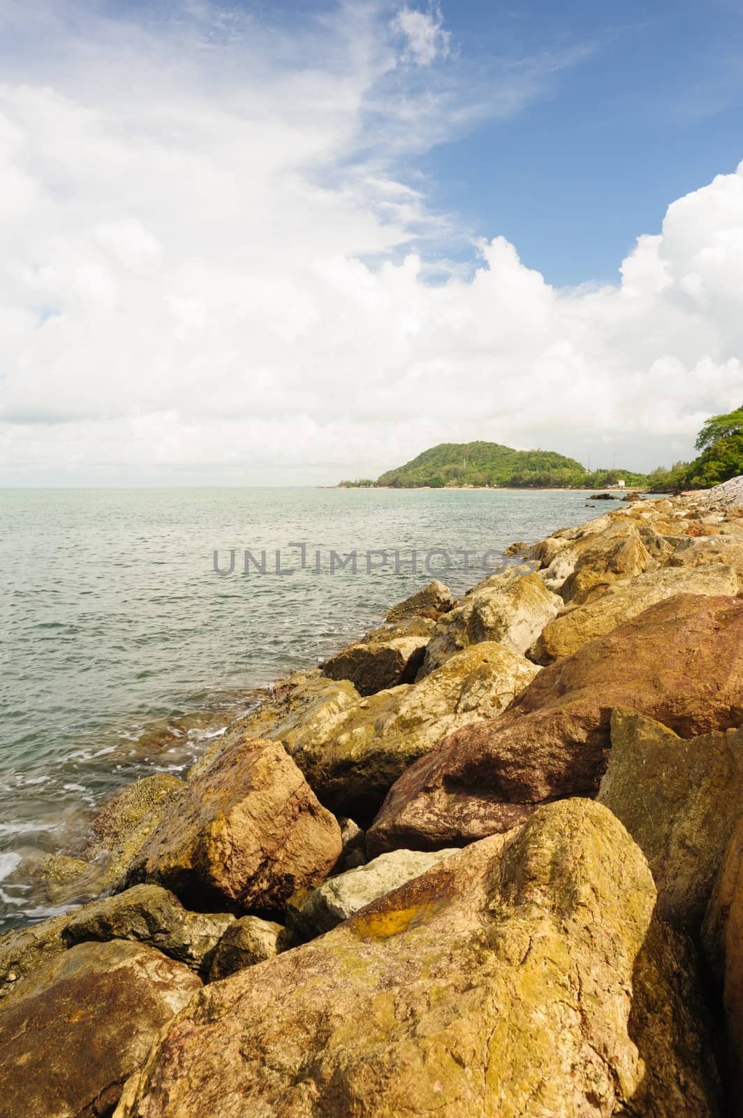 Stone wave barrier near seashore in Chanthaburi, Thailand.