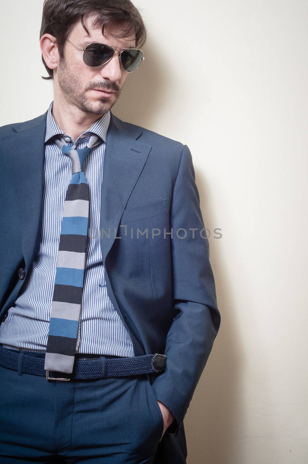 businessman stylish fashion posing elegant on gray background