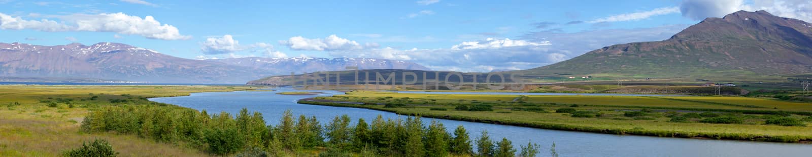 Iceland summer landscape. Fjord, house, mountains. Panorama.