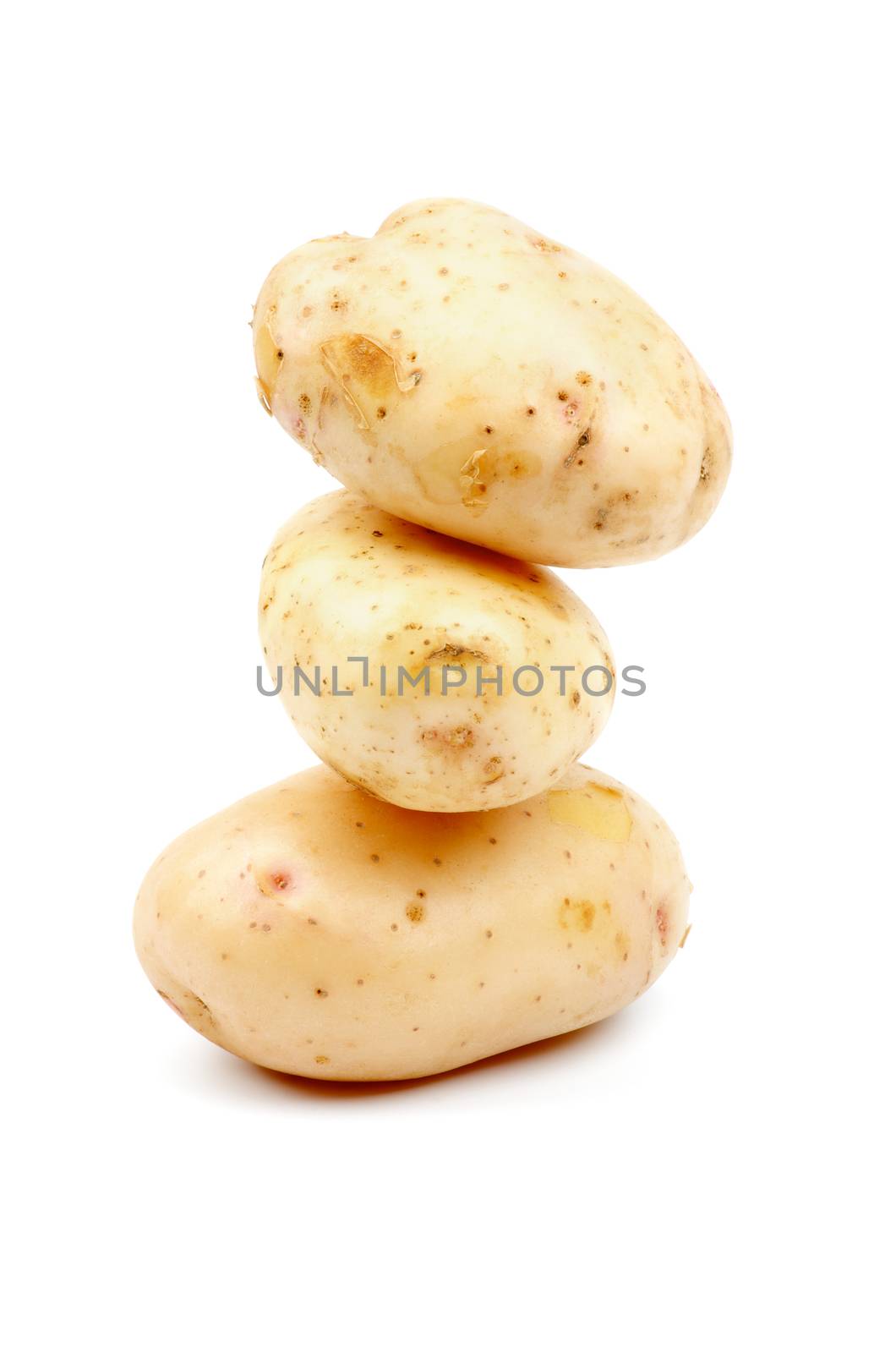 Stack of Three Raw New Harvest Potato isolated on white background