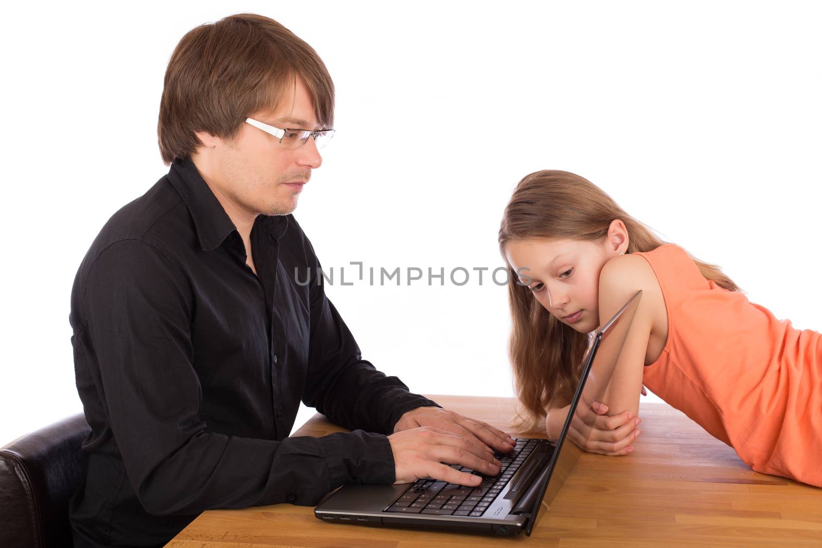 Daughter looks at her father's laptop. Isolated on a white background.
