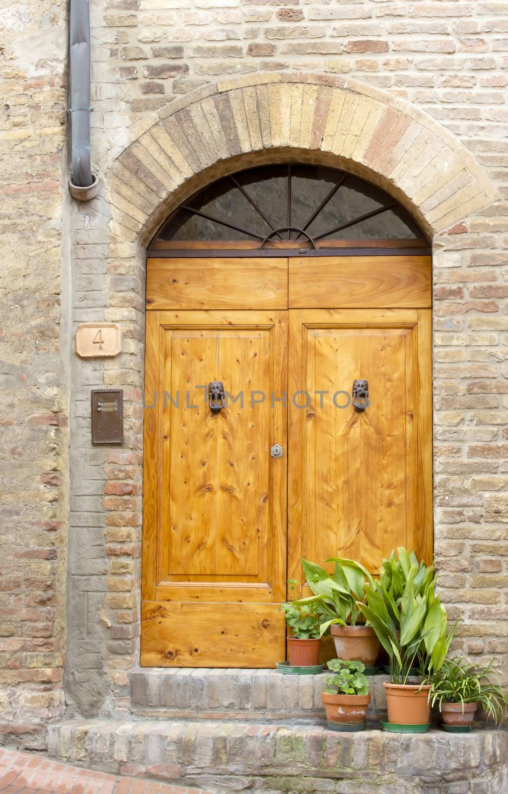 lovely tuscan doors, San Gimignano, Italy by miradrozdowski