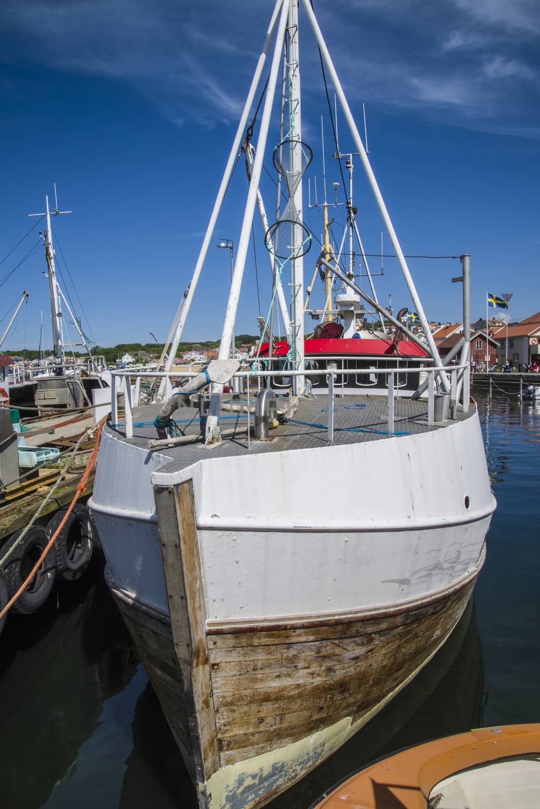 The fishing boats is moored to the docks in Grebbestad, Sweden.