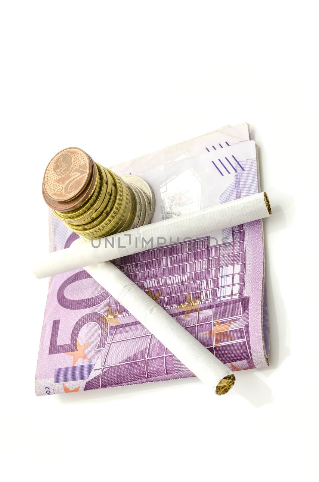 Euro money and cigarettes isolated over white background. Concept of expensive smoking habit.