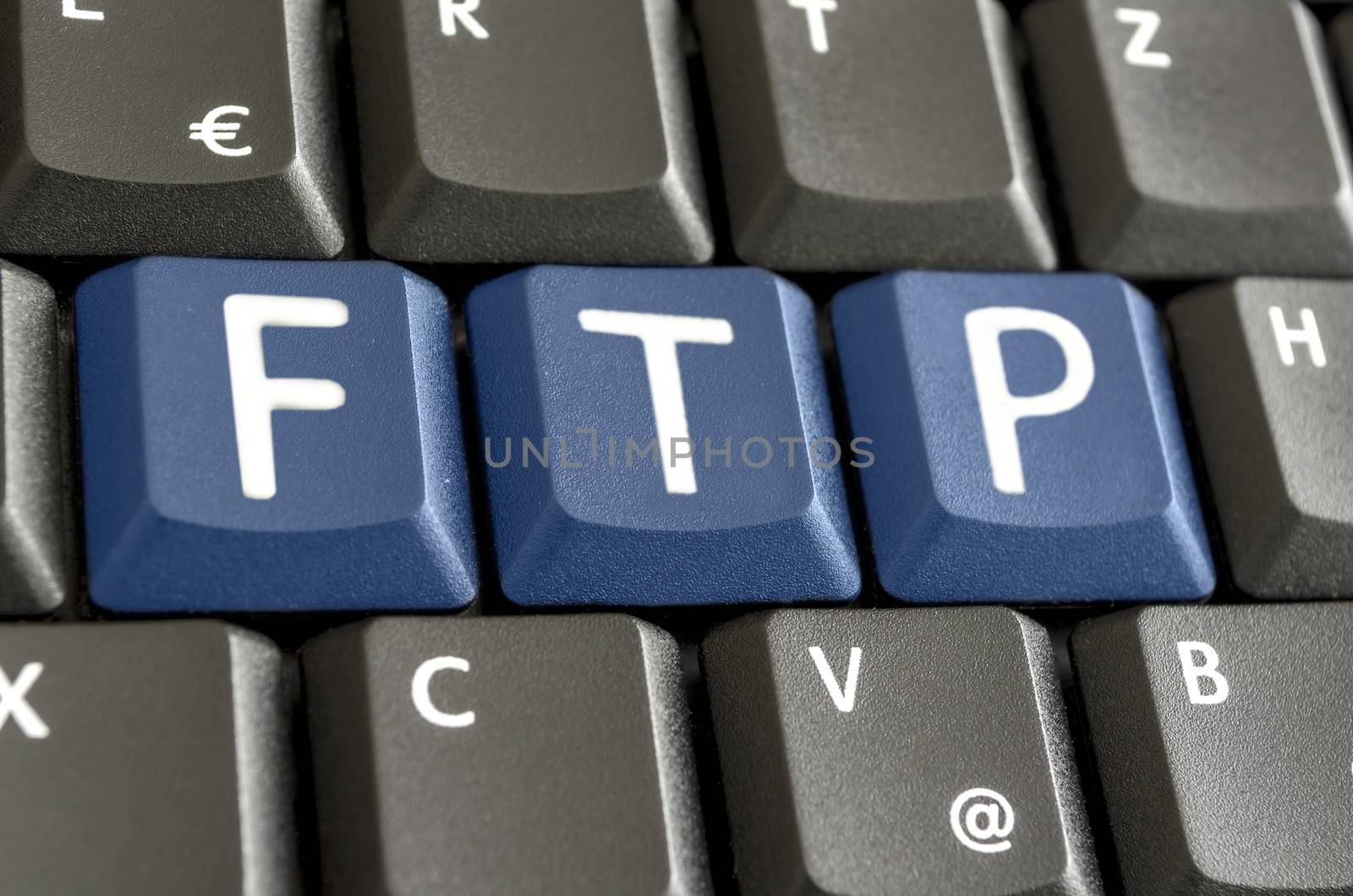 FTP written with blue keys on computer keyboard.