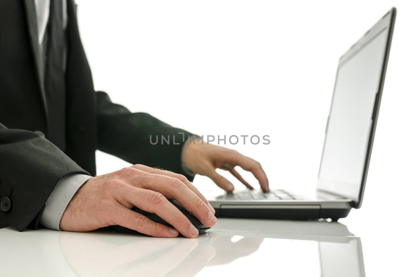 Close up of business man working on laptop. Isolated over white background.