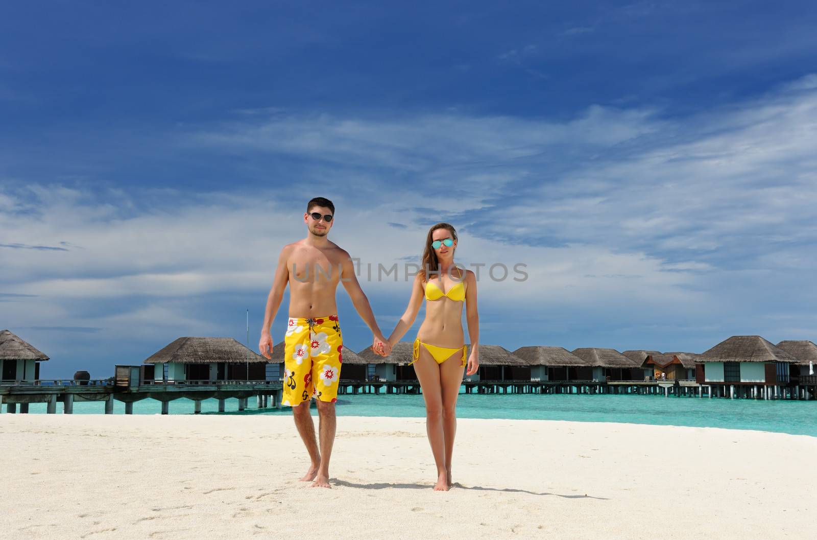 Couple on a tropical beach at Maldives