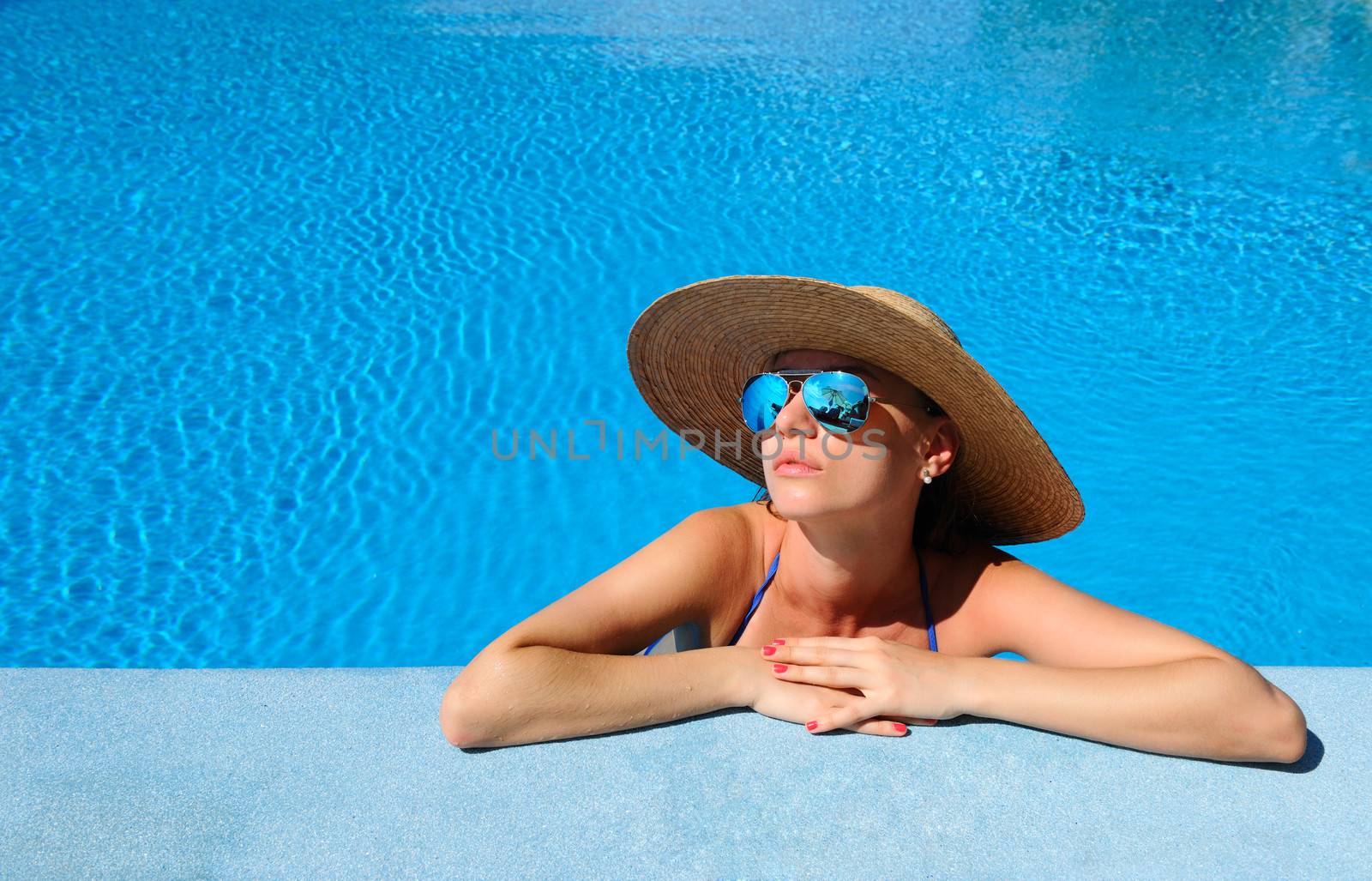 Woman at poolside by haveseen
