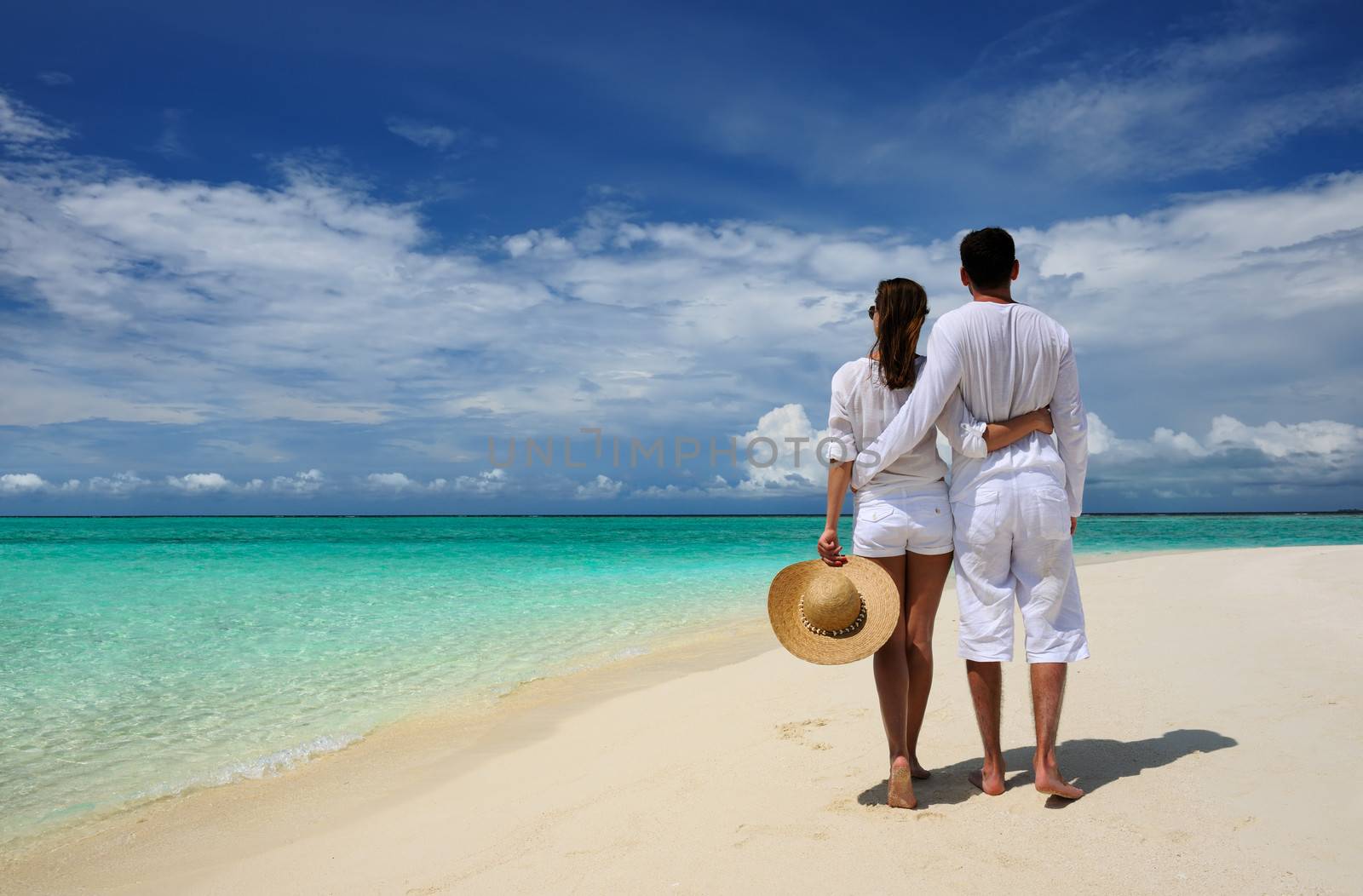 Couple on a beach at Maldives by haveseen