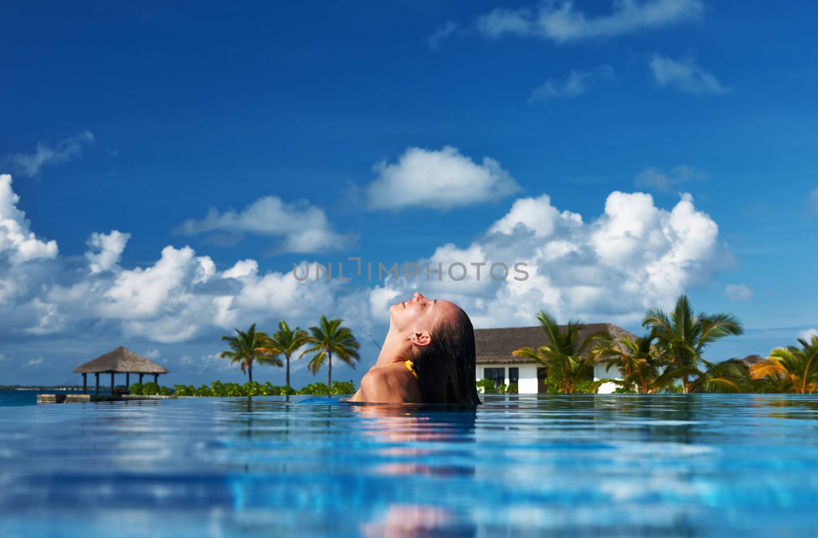 Woman at poolside by haveseen