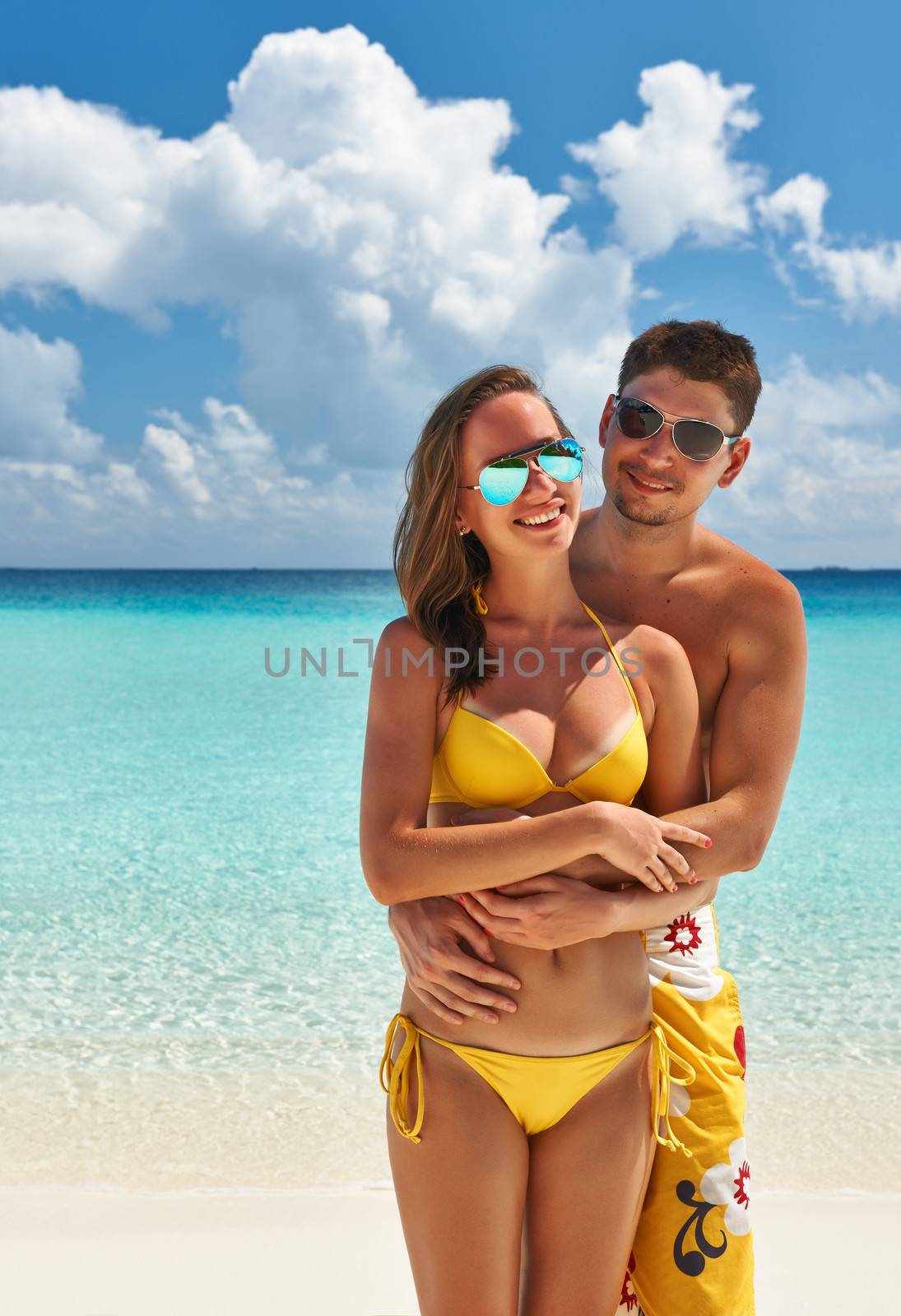 Couple on a tropical beach at Maldives