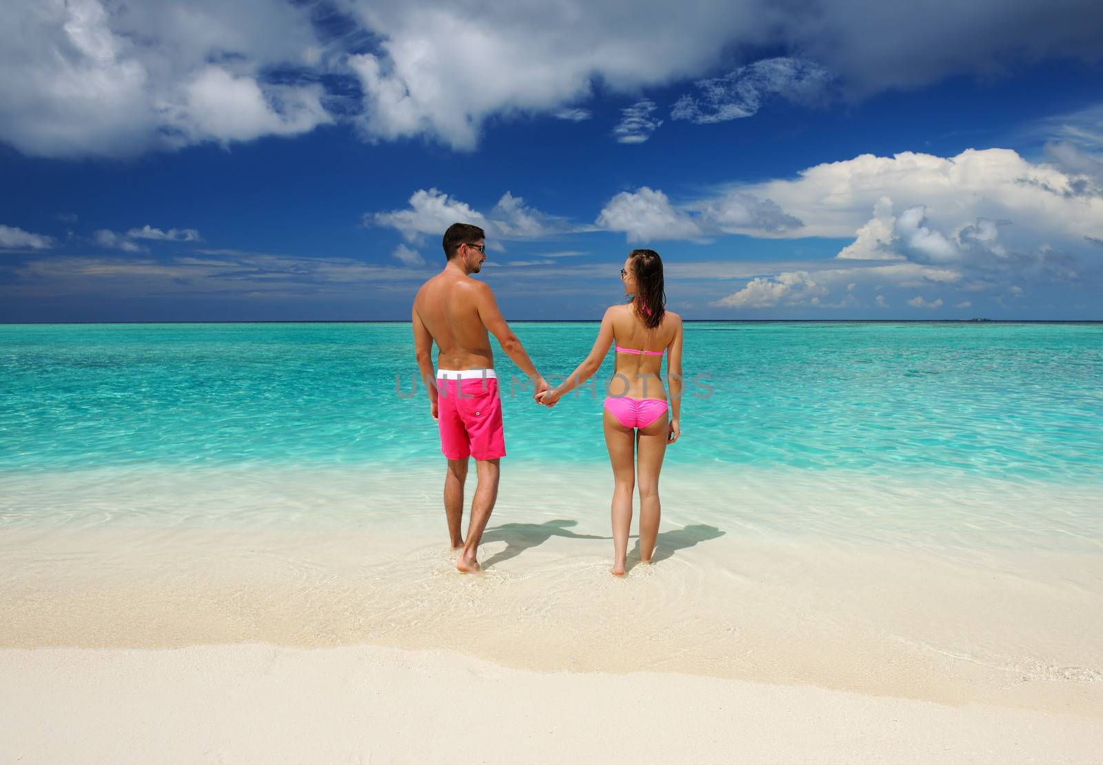 Couple on a tropical beach at Maldives